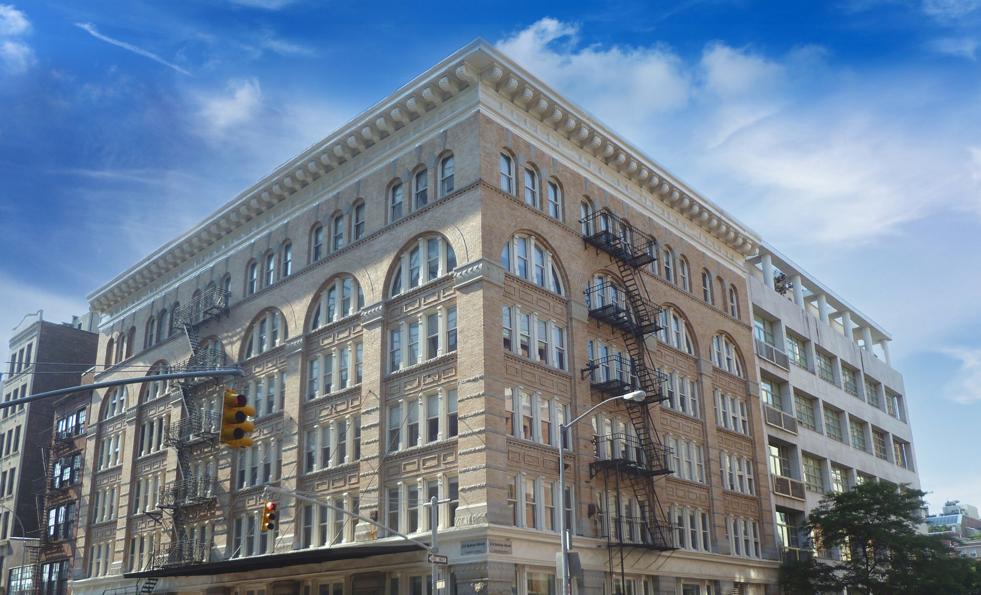 174 Hudson Street, a six-story Tribeca loft building at the corner of Hudson and Vestry